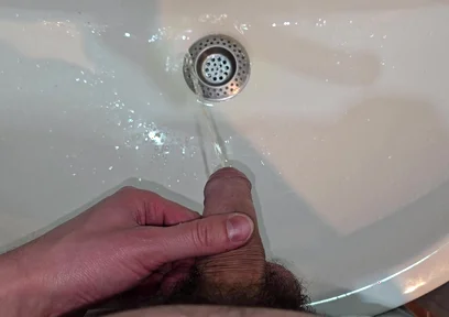 Hairy Cock Peeing Into the Sink in Bathroom with a Strong Stream
