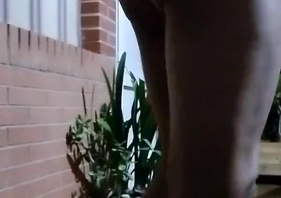 In the Doorway in a Thong and with an Anal Plug