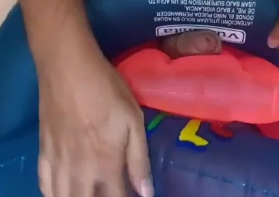 Playing with inflatable swim ring