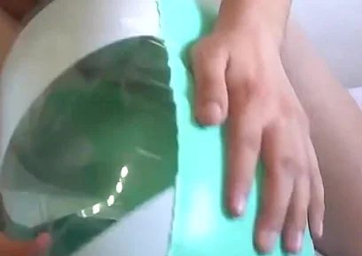 Playing with a Green and White Swimring