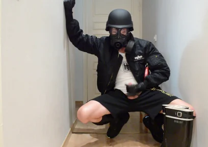 Gas masked guy cums on his rubber boots