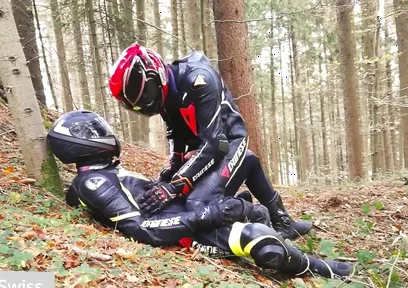 German dainese bikers having fun in the wood