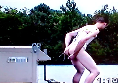 Crossdresser Riding a Giant Dildo on a Roof Top