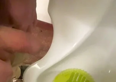 Amateur Redhead Guy Caught Pissing in a Public Toilet's Urinal - He Then Quickly Plays with His Cock Before Leaving