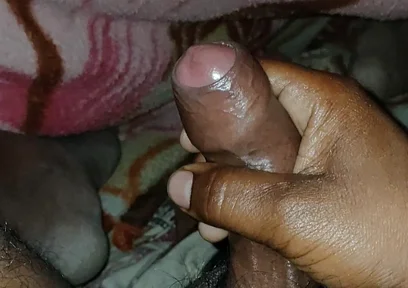 Big Boss massaging penis oil under the blanket