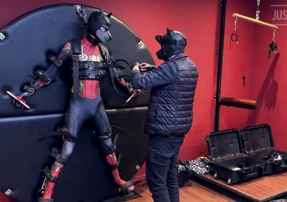 Pup Twink Dressed as Spider-man Strapped to the Bondage Wheel and Milked