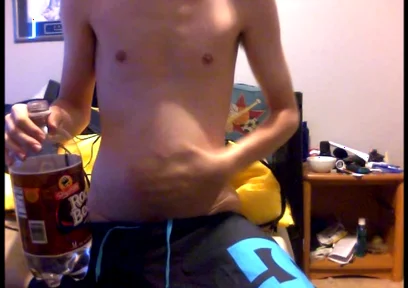 Young Guy Fills His Stomach with Water