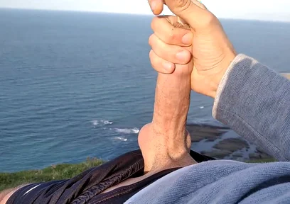 Huge Dirty Cock Gets Handjob on the Beach and Squirts a Lot of Thick Sperm in Front of the Beach