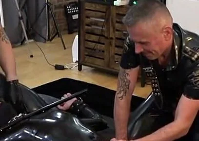 Rubber Gimp Bound and Used by Two Latex Guys Part 1