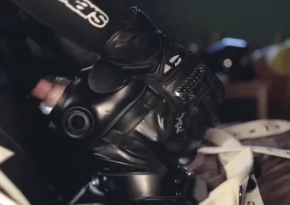 Rubber boy sucking biker master cock