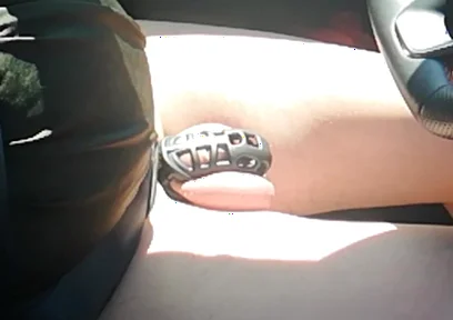 Small Penis in Cage While Driving in Pantyhose