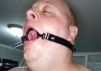 Deepthroating a 7 Inch Dildo with Mouth Gag Ring