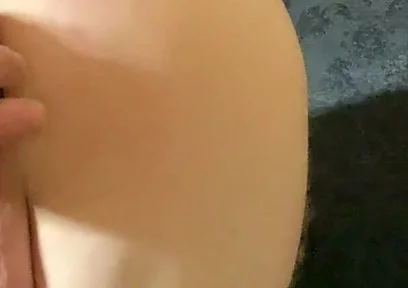 A Crossdresser in Leggings and a Seductive Bodysuit Plays with Ass