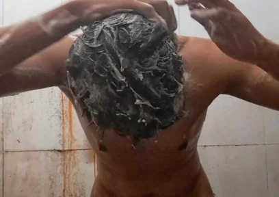 Exotic Skinned Adult Man Taking a Bath in the Afternoon