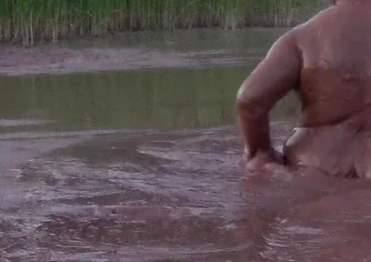 Mud Bath in Deep Quarry Mud Pond