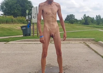 Naked and Pissing in Parking Lot