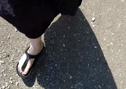 Outdoor in a Black Caftan and Barefoot in Black Birkenstocks