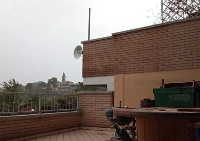 On the Terrace, in the Rain