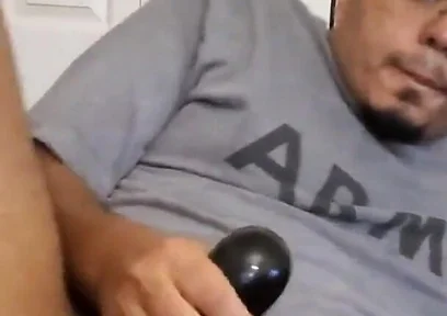 Browndicksavior Using His Oral Sex Toy and Stroking His Brown Cock