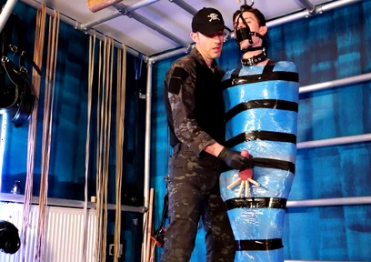 Twink Slave Bound in Pallet Wrap for Orgasm Control
