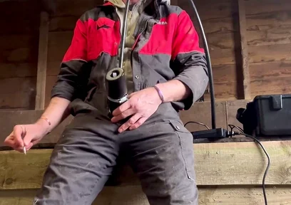 Farmer Smokes and Milks Himself with the Milking Machine