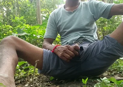 Indian mature masterbating in forest.