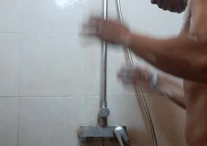 Exotic Skinned Asian Adult Man Taking a Shower in the Morning
