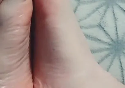 Guy Gently Massages His Feet with Oil