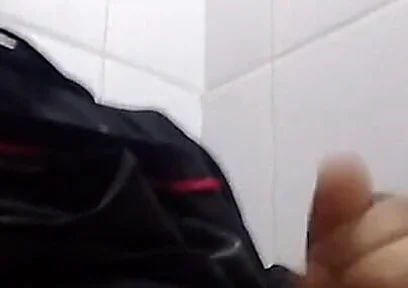 Man Sits in the Bathroom