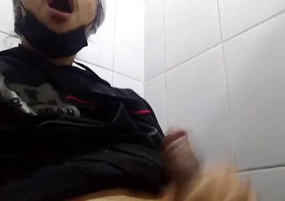Man Sits in the Bathroom