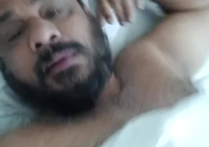 Indian Daddy Lying on the Bed Teasing and Posing for You